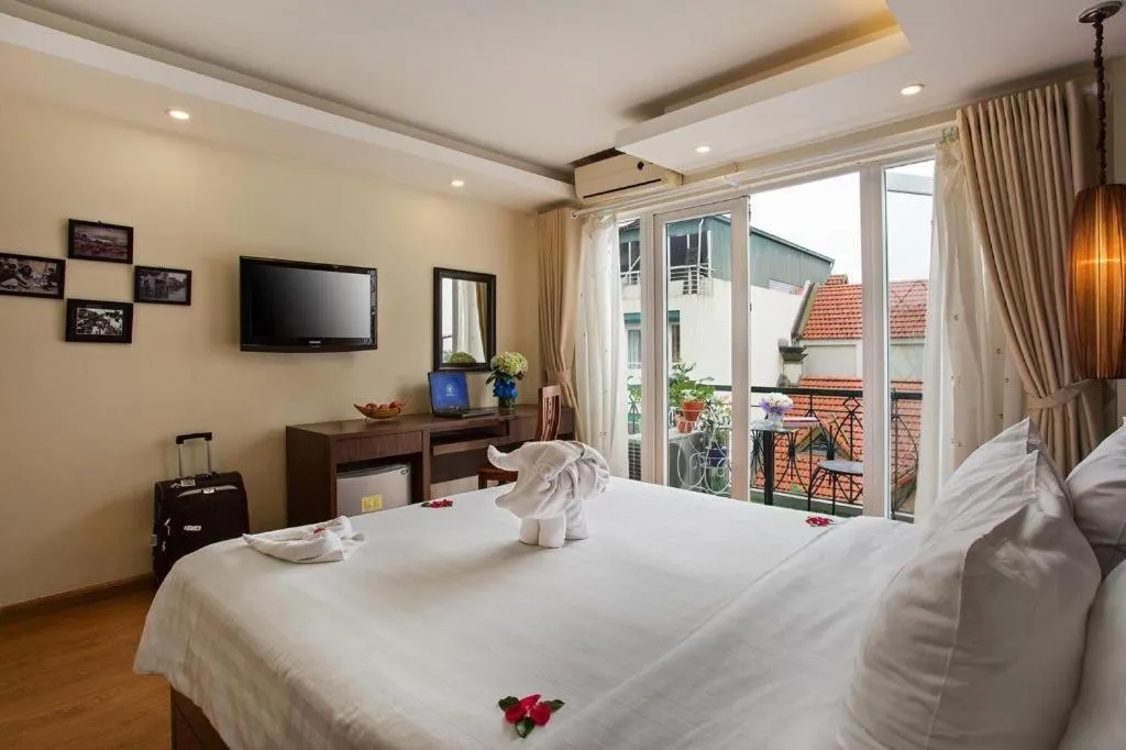 Bed in Hanoi Impressive Hotel