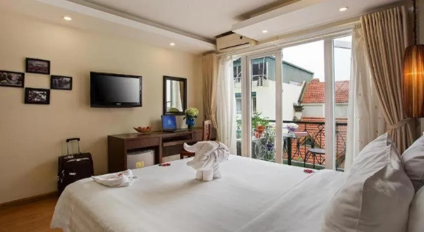 Bed in Hanoi Impressive Hotel