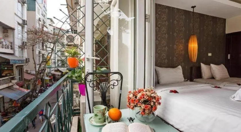 Bed in Hanoi Impressive Hotel