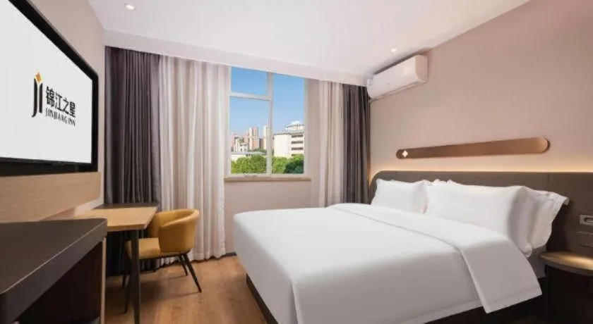 Bed in Jinjiang Inn Wuhan Hanjiang Road Metro Station Jiangtan Pedestrian Street