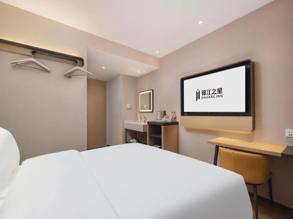 Bed in Jinjiang Inn Wuhan Hanjiang Road Metro Station Jiangtan Pedestrian Street