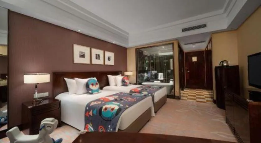 Bed in New Century Hangzhou Grand Hotel