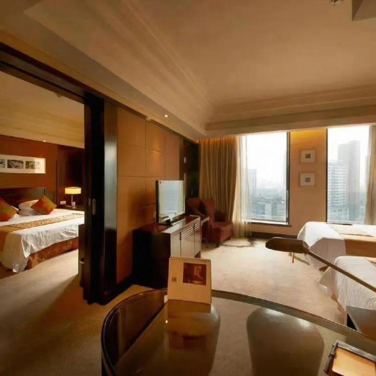 Bed in New Century Hangzhou Grand Hotel