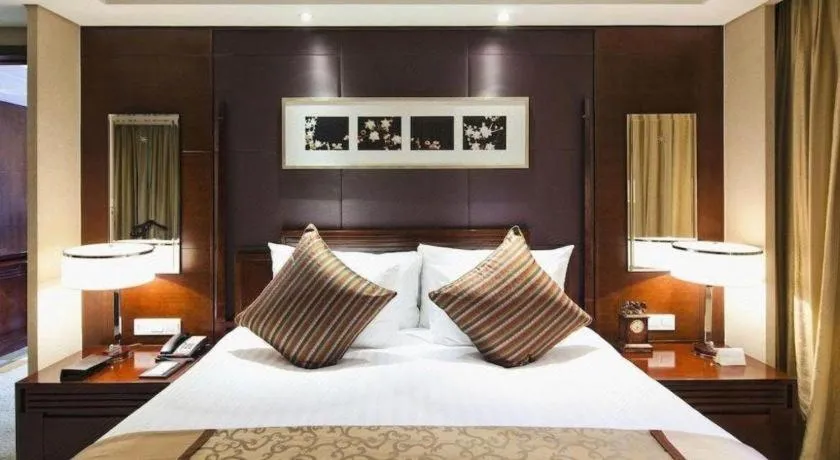 Bed in New Century Hangzhou Grand Hotel