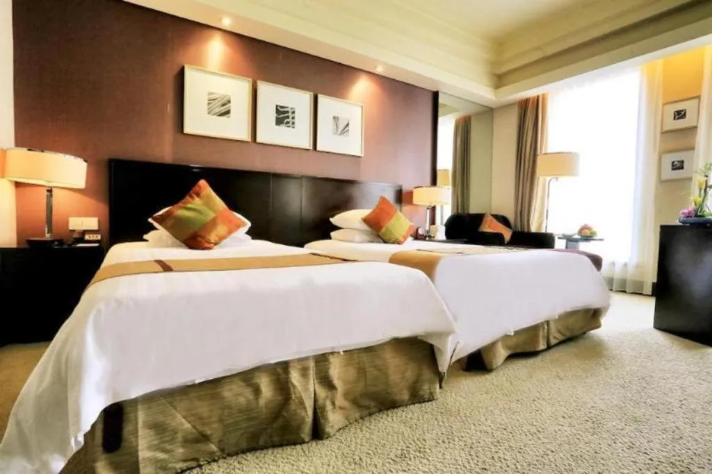 Bed in New Century Hangzhou Grand Hotel