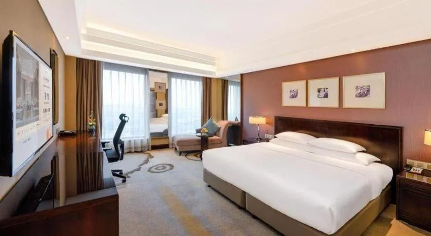 Bed in New Century Hangzhou Grand Hotel