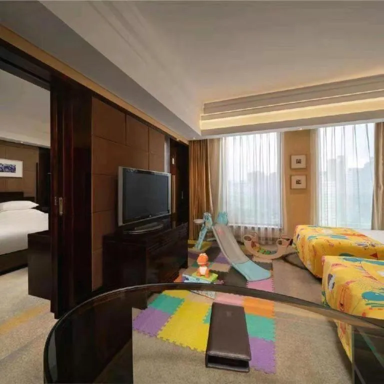 Bed in New Century Hangzhou Grand Hotel