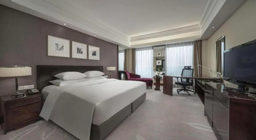 Bed in New Century Hangzhou Grand Hotel