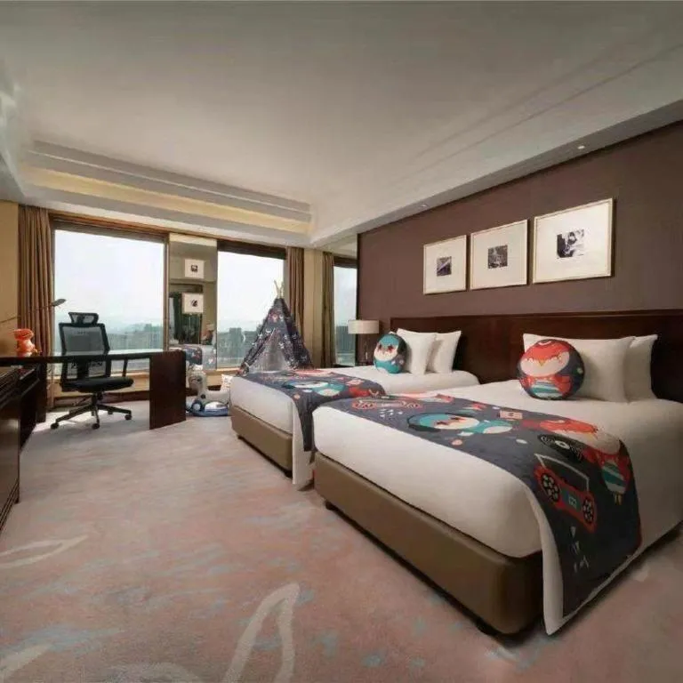 Bed in New Century Hangzhou Grand Hotel