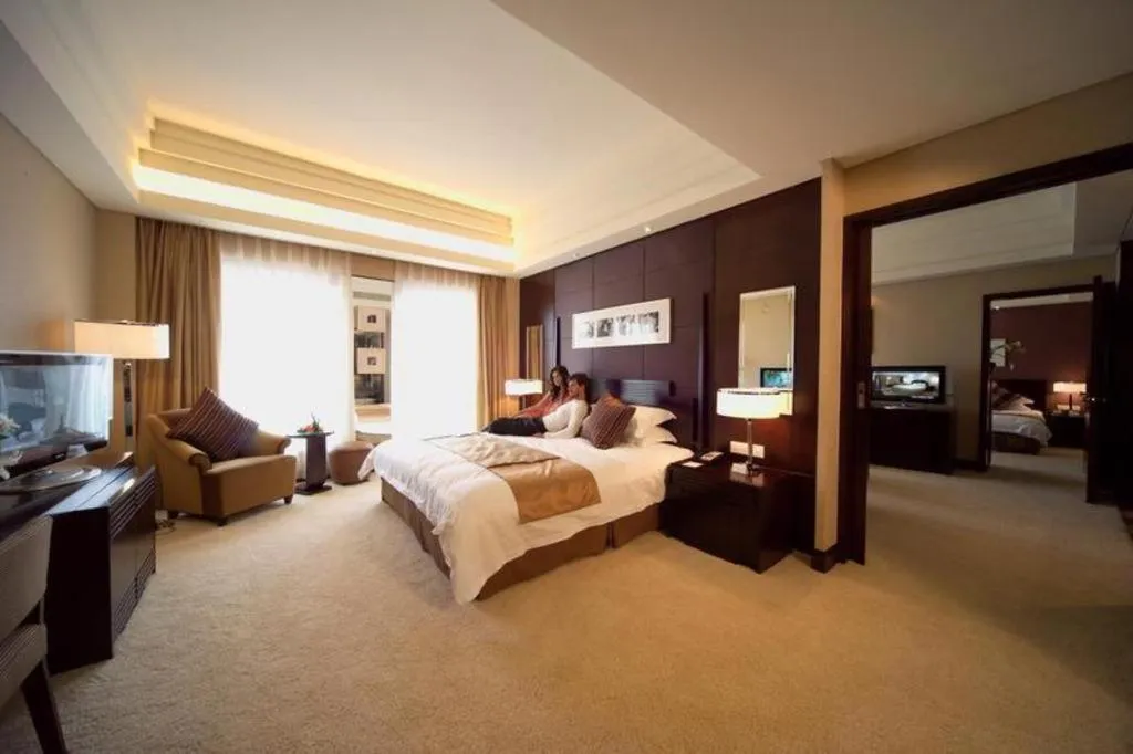 Bed in New Century Hangzhou Grand Hotel
