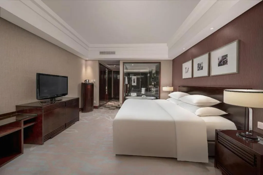 Bed in New Century Hangzhou Grand Hotel
