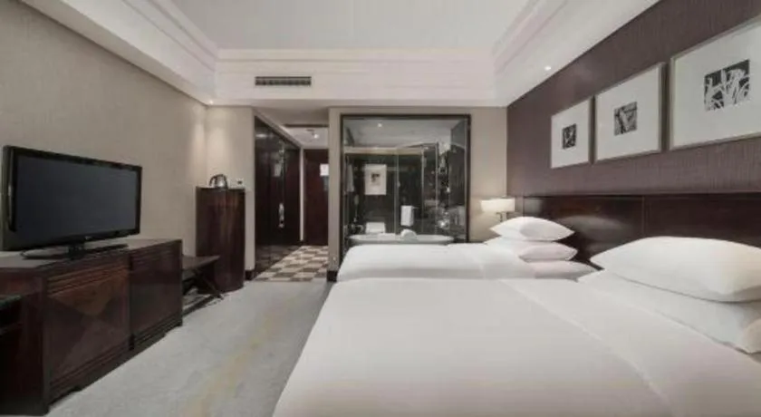 Bed in New Century Hangzhou Grand Hotel