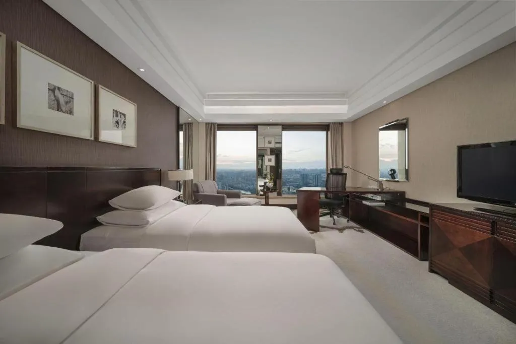 Bed in New Century Hangzhou Grand Hotel
