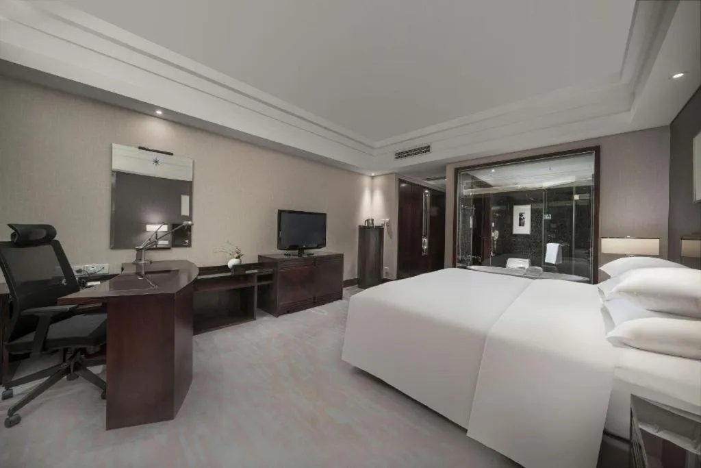 Bed in New Century Hangzhou Grand Hotel