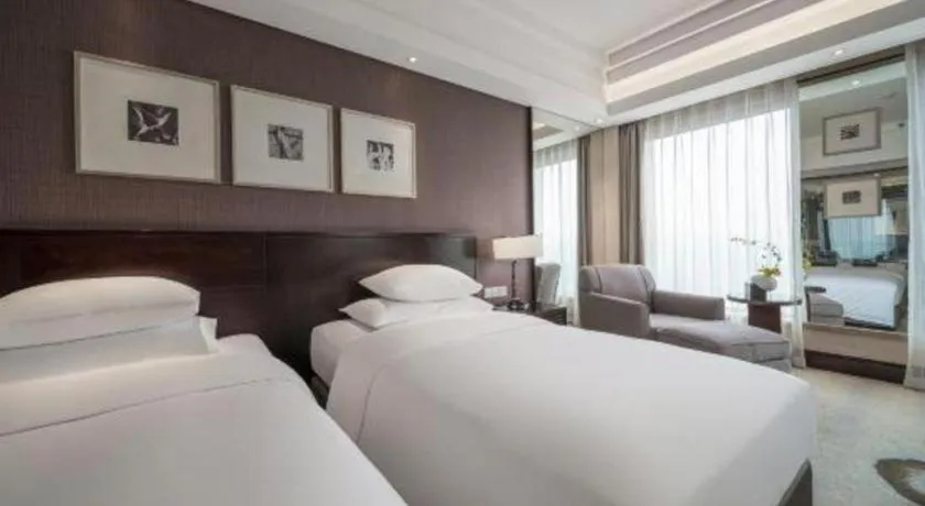 Bed in New Century Hangzhou Grand Hotel