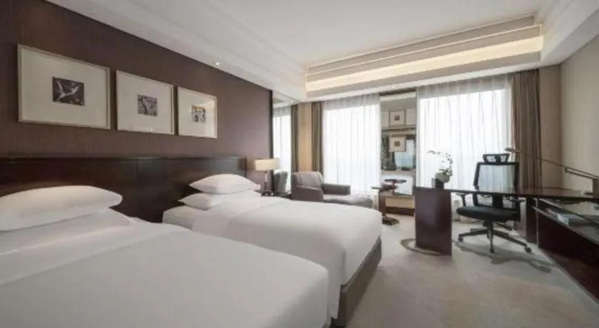 Bed in New Century Hangzhou Grand Hotel