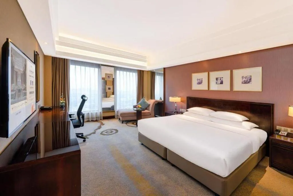 Bed in New Century Hangzhou Grand Hotel