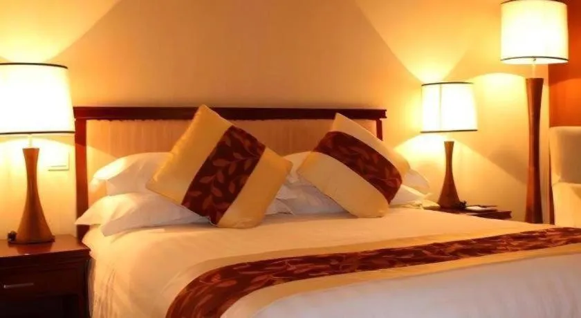 Bed in New Century Hotel Ninghai