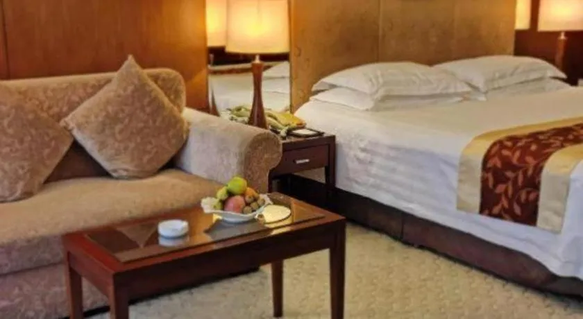 Bed in New Century Hotel Ninghai