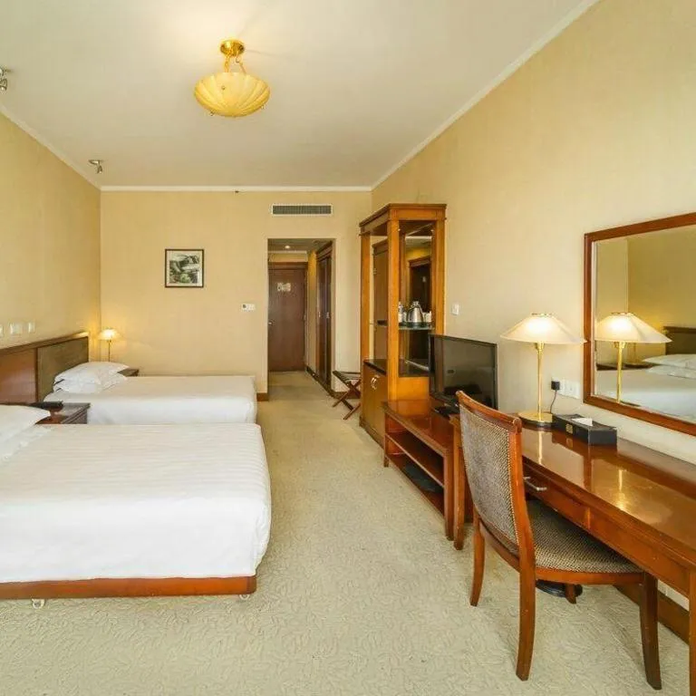 Bed in New Century Hotel Ninghai
