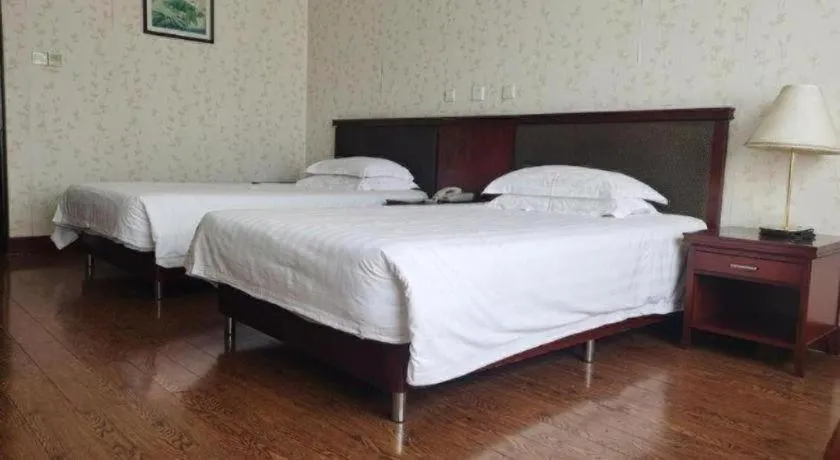 Bed in New Century Hotel Ninghai