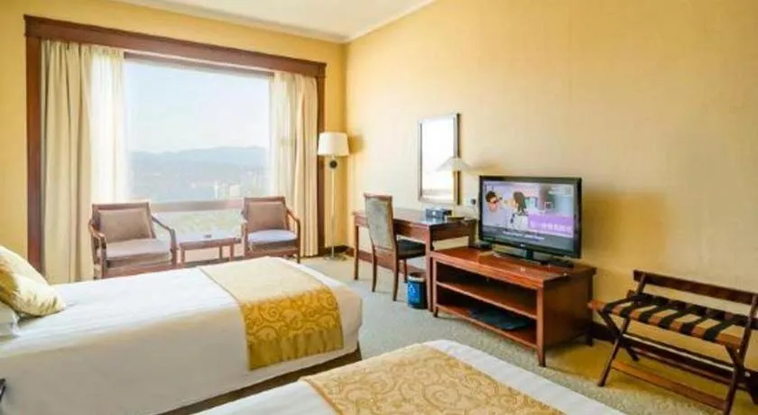 Bed in New Century Hotel Ninghai