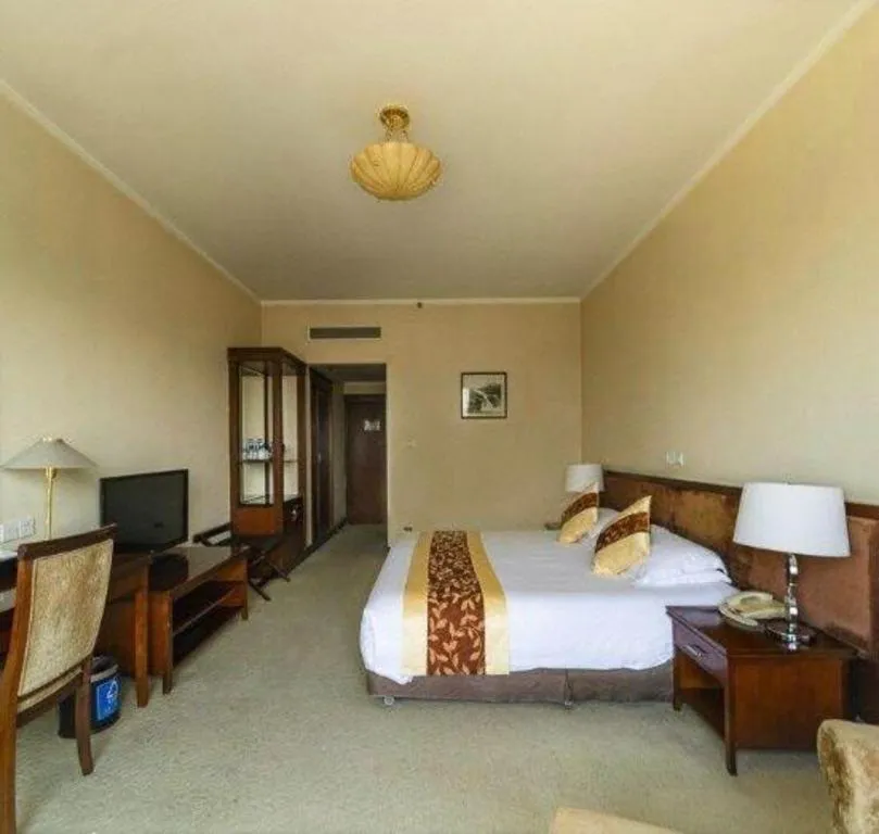 Bed in New Century Hotel Ninghai