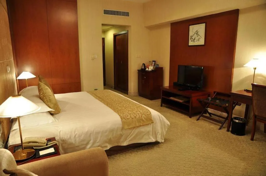 Bed in New Century Hotel Ninghai