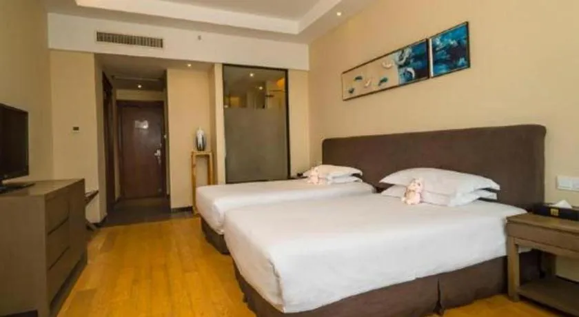Bed in New Century Hotel Ninghai