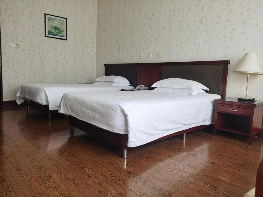 Bed in New Century Hotel Ninghai