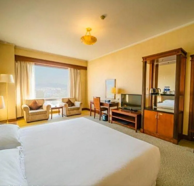 Bed in New Century Hotel Ninghai