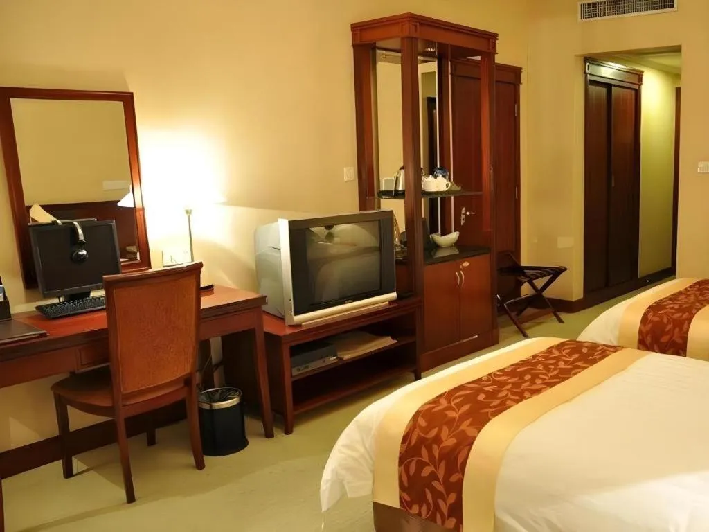 Bed in New Century Hotel Ninghai