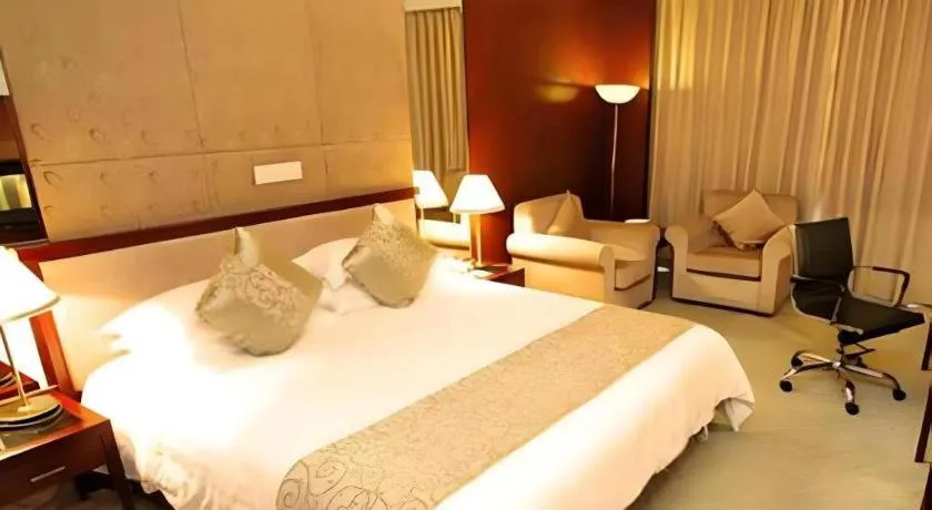 Bed in New Century Hotel Ninghai