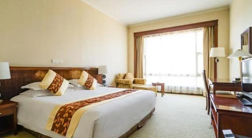 Bed in New Century Hotel Ninghai