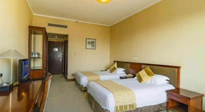 Bed in New Century Hotel Ninghai