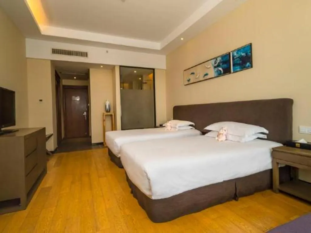 Bed in New Century Hotel Ninghai