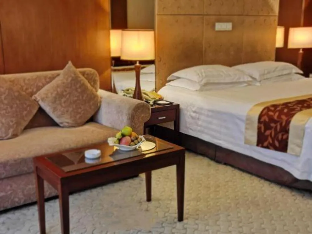 Bed in New Century Hotel Ninghai