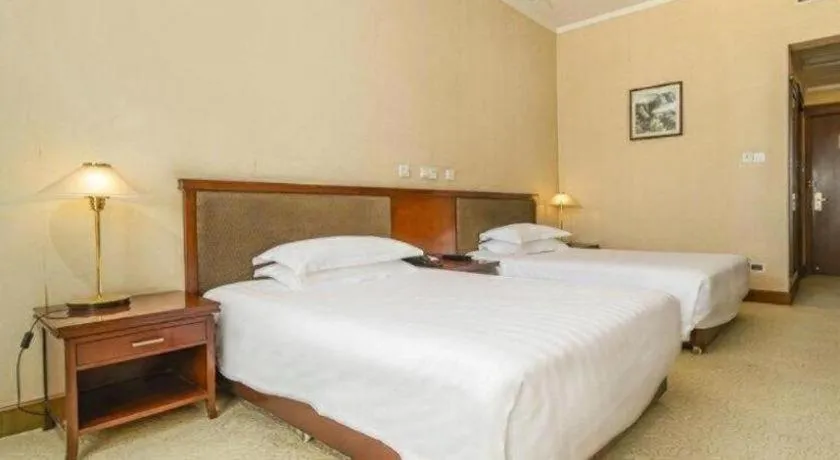 Bed in New Century Hotel Ninghai