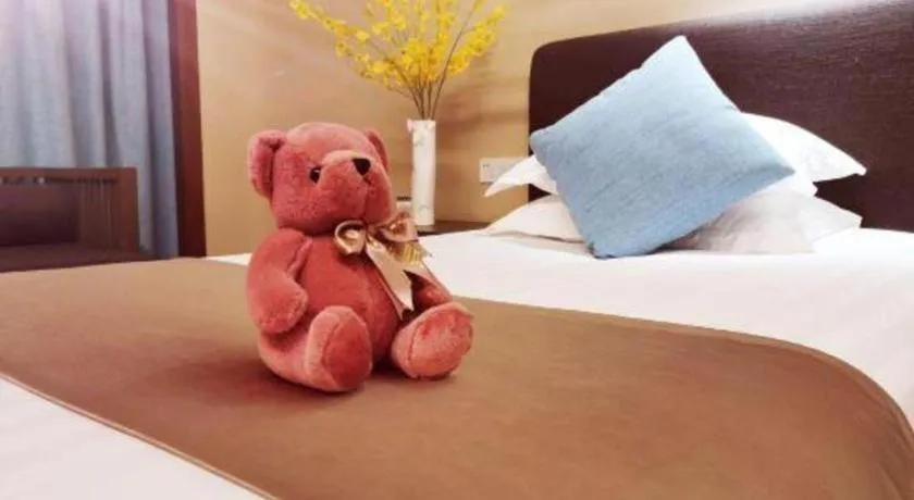 Bed in New Century Hotel Ninghai