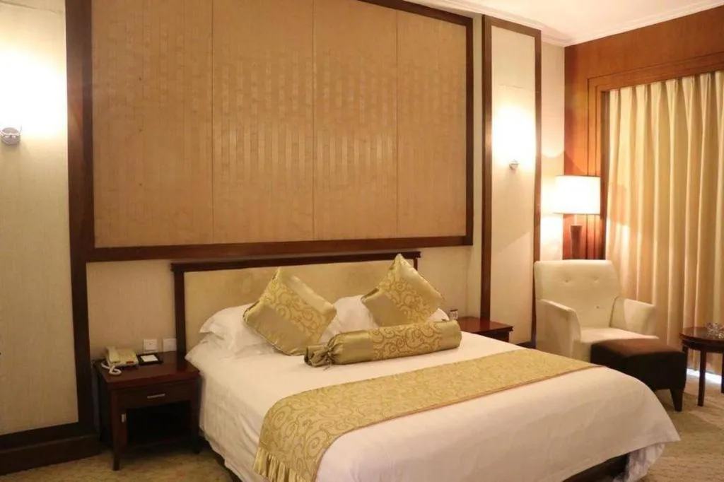 Bed in New Century Hotel Ninghai