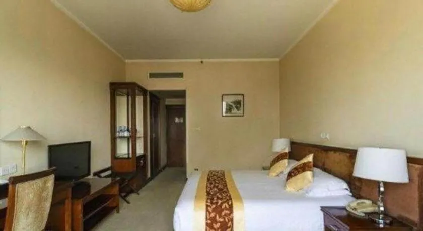 Bed in New Century Hotel Ninghai