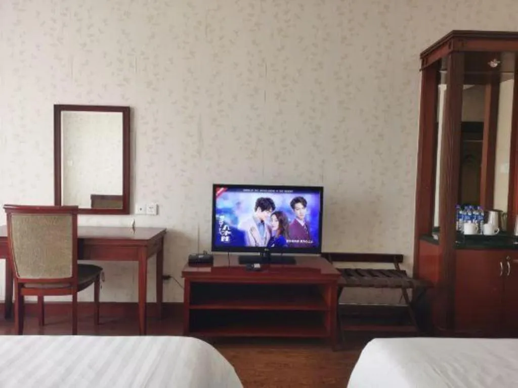 Bed in New Century Hotel Ninghai