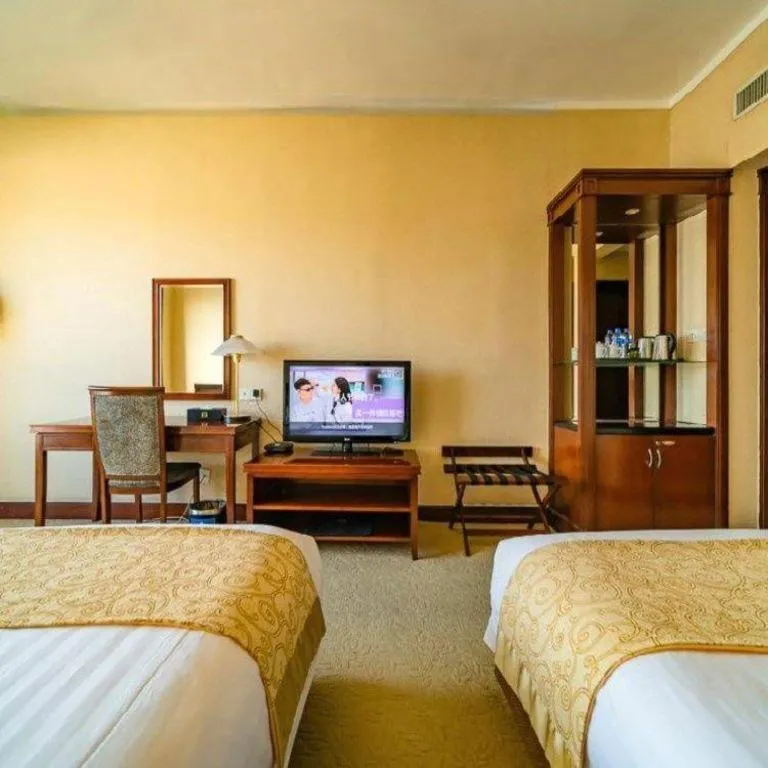 Bed in New Century Hotel Ninghai