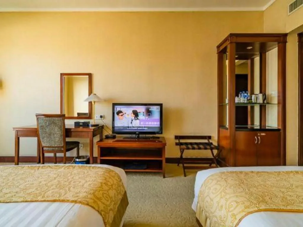 Bed in New Century Hotel Ninghai