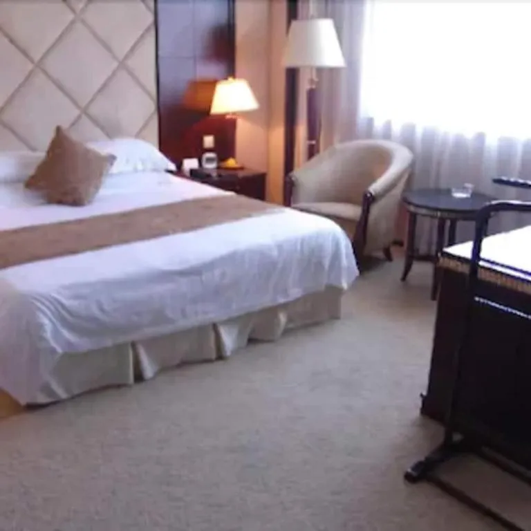 Bed in New Century Hotel Taizhou