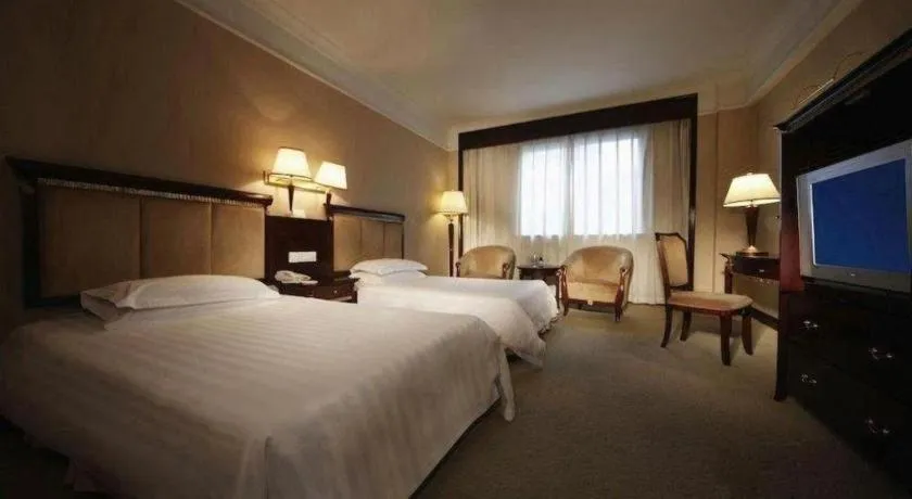 Bed in New Century Hotel Taizhou