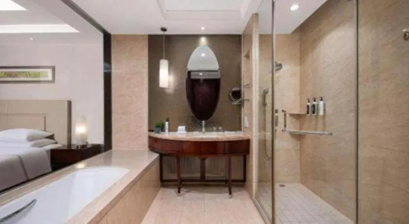 Bed in New Century Grand Changchun Hotel