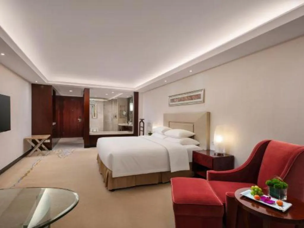 Bed in New Century Grand Changchun Hotel