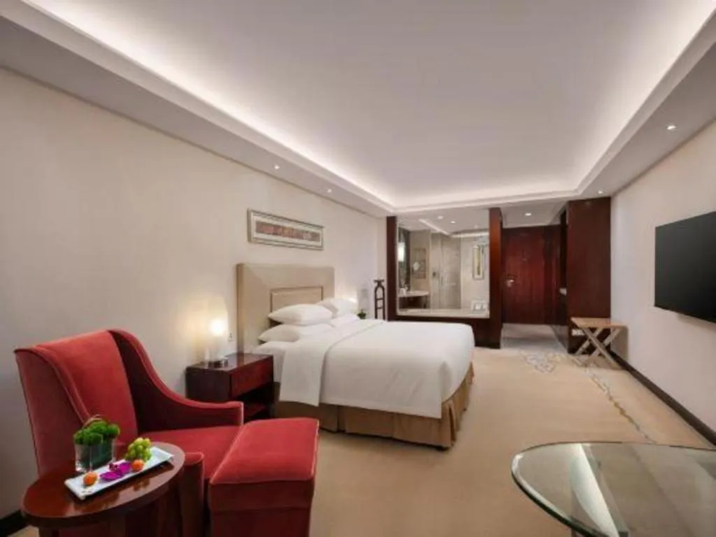 Bed in New Century Grand Changchun Hotel