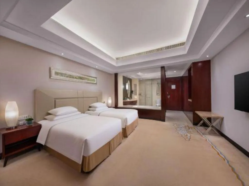 Bed in New Century Grand Changchun Hotel